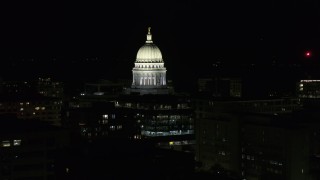DX0002_162_043 - 5.7K aerial stock footage closely orbiting the capital dome at night, Madison, Wisconsin