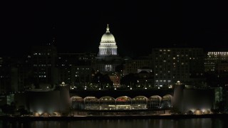 DX0002_162_046 - 5.7K aerial stock footage a view of the capital dome at night, reveal convention center, Madison, Wisconsin