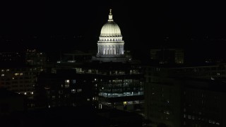 DX0002_162_053 - 5.7K aerial stock footage slowly orbit the dome of the capital building at night, Madison, Wisconsin