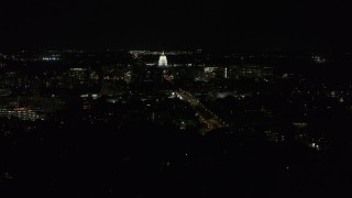 DX0002_163_009 - 5.7K aerial stock footage slowly orbit of Wisconsin State Capitol, seen from Washington Ave at night, Madison, Wisconsin