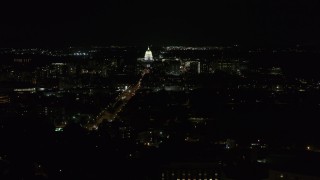 DX0002_163_010 - 5.7K aerial stock footage of Wisconsin State Capitol at the end of Washington Ave at night, Madison, Wisconsin