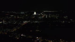 DX0002_163_011 - 5.7K aerial stock footage of the state capitol at the end of Washington Ave at night, Madison, Wisconsin