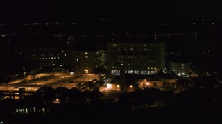 DX0002_163_017 - 5.7K aerial stock footage of an orbit of a hospital at night, Madison, Wisconsin
