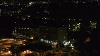 DX0002_163_021 - 5.7K aerial stock footage orbit a hospital complex at night, Madison, Wisconsin