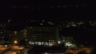 DX0002_163_022 - 5.7K aerial stock footage orbit part of a hospital complex at night, Madison, Wisconsin