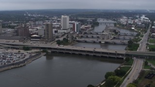 DX0002_164_006 - 5.7K stock footage aerial video a reverse view of bridges spanning the river by Downtown Cedar Rapids, Iowa