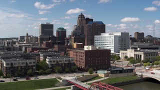 DX0002_165_003 - 5.7K stock footage aerial video the city's skyline seen while passing apartment buildings in Downtown Des Moines, Iowa