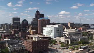DX0002_165_005 - 5.7K aerial stock footage the city's skyline seen while ascending past office buildings in Downtown Des Moines, Iowa