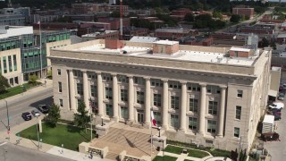 DX0002_165_006 - 5.7K stock footage aerial video orbiting the Des Moines Police Department building in Des Moines, Iowa