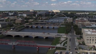 DX0002_165_011 - 5.7K aerial stock footage of several bridges spanning the river in Des Moines, Iowa