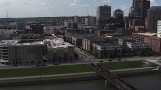 DX0002_165_013 - 5.7K aerial stock footage orbit hotels and apartment complex, reveal skyline of Downtown Des Moines, Iowa