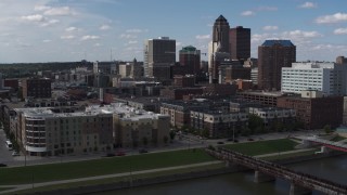 DX0002_165_016 - 5.7K aerial stock footage an orbit of hotels and apartment complex, reveal train tracks, Downtown Des Moines, Iowa