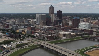 DX0002_165_021 - 5.7K stock footage aerial video of the city's skyline seen from a bridge over the river, Downtown Des Moines, Iowa