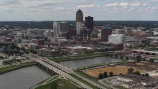 DX0002_165_022 - 5.7K aerial stock footage fly away from the city's skyline and bridges over the river, Downtown Des Moines, Iowa