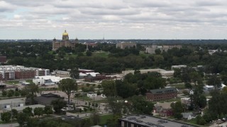 DX0002_165_024 - 5.7K aerial stock footage of flying away from and by the Iowa State Capitol and grounds in Des Moines, Iowa