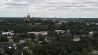 DX0002_165_025 - 5.7K aerial stock footage of passing by and the approaching the Iowa State Capitol and grounds in Des Moines, Iowa