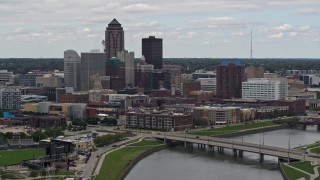 DX0002_165_033 - 5.7K stock footage aerial video of a stationary view of the Cedar River and skyline of Downtown Des Moines, Iowa