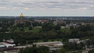 DX0002_165_038 - 5.7K aerial stock footage of descending past the Iowa State Capitol and grounds in Des Moines, Iowa