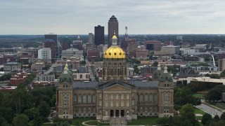 DX0002_166_006 - 5.7K stock footage aerial video of flying by the Iowa State Capitol with a view of the Downtown Des Moines, Iowa skyline