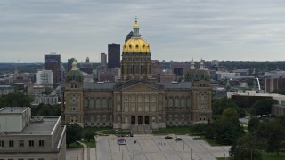 DX0002_166_013 - 5.7K stock footage aerial video circling around the front of the Iowa State Capitol, skyline in the background, Des Moines, Iowa
