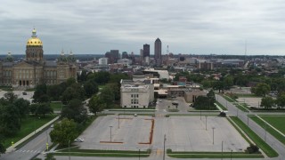 DX0002_166_034 - 5.7K aerial stock footage reverse view of distant skyline seen from the state library and capitol, Downtown Des Moines, Iowa