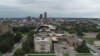 DX0002_166_041 - 5.7K aerial stock footage of the distant skyline seen while descending by state library building, Des Moines, Iowa
