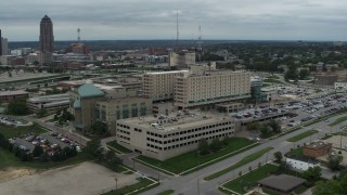 DX0002_166_048 - 5.7K aerial stock footage orbit a hospital in Des Moines, Iowa and fly away