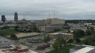 DX0002_166_049 - 5.7K aerial stock footage of a hospital in Des Moines, Iowa while descending
