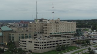 DX0002_167_006 - 5.7K aerial stock footage fly away from a hospital in Des Moines, Iowa