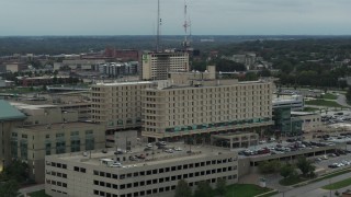 DX0002_167_009 - 5.7K aerial stock footage approach and orbit side of a hospital in Des Moines, Iowa