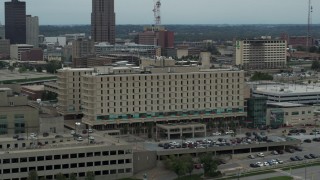 DX0002_167_010 - 5.7K aerial stock footage orbit top floors of a hospital in Des Moines, Iowa
