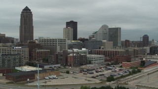 DX0002_167_032 - 5.7K stock footage aerial video fly away from office buildings and a skyscraper in Downtown Des Moines, Iowa