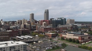 DX0002_168_002 - 5.7K aerial stock footage of a reverse view of the city's skyline in Downtown Omaha, Nebraska