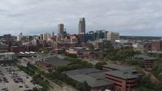 DX0002_168_003 - 5.7K aerial stock footage of flying away from the city's skyline in Downtown Omaha, Nebraska