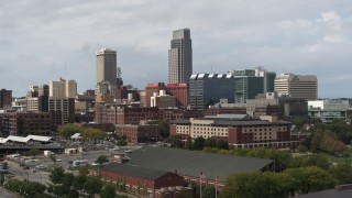 DX0002_168_008 - 5.7K stock footage aerial video ascend and flyby the downtown skyline in Downtown Omaha, Nebraska