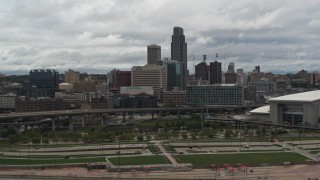 DX0002_168_018 - 5.7K aerial stock footage of a view of the city skyline from riverfront park, Downtown Omaha, Nebraska