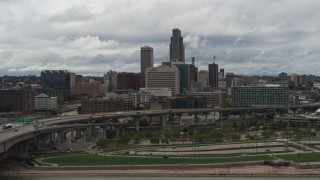 DX0002_168_019 - 5.7K aerial stock footage of a reverse view of the city skyline from riverfront park, Downtown Omaha, Nebraska