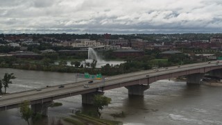 DX0002_168_023 - 5.7K aerial stock footage of a fountain in a riverfront park across the Missouri River, Omaha, Nebraska