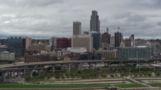 DX0002_169_001 - 5.7K aerial stock footage of the city skyline seen from riverfront park, Downtown Omaha, Nebraska