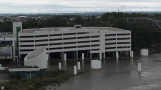 DX0002_169_013 - 5.7K aerial stock footage orbit a flooded parking garage in Council Bluffs, Iowa