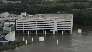 DX0002_169_016 - 5.7K aerial stock footage orbit around a flooded parking garage in Council Bluffs, Iowa