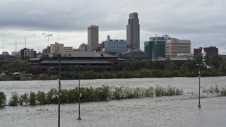 DX0002_169_022 - 5.7K aerial stock footage of Missouri River and riverfront park with view of skyline, Downtown Omaha, Nebraska