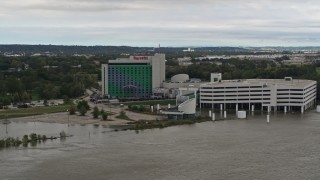 DX0002_169_038 - 5.7K aerial stock footage of the hotel and casino in Council Bluffs, Iowa, seen from the river