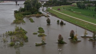 DX0002_169_040 - 5.7K aerial stock footage of orbiting flooded parking lot in Council Bluffs, Iowa