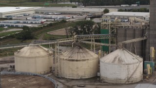 DX0002_170_005 - 5.7K aerial stock footage storage tanks and grain elevator in Council Bluffs, Iowa