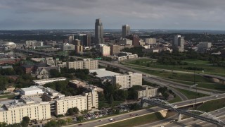 DX0002_170_010 - 5.7K stock footage aerial video of the city's skyline seen from university and apartment complex, Downtown Omaha, Nebraska