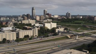 DX0002_170_014 - 5.7K aerial stock footage of the city's skyline seen from university and North Freeway, Downtown Omaha, Nebraska