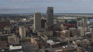 DX0002_170_023 - 5.7K aerial stock footage of orbiting skyscrapers towering over city buildings in Downtown Omaha, Nebraska