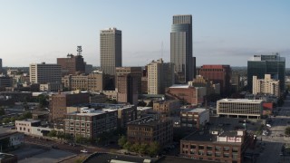 DX0002_170_037 - 5.7K aerial stock footage ascend with view of the city's skyscrapers in Downtown Omaha, Nebraska