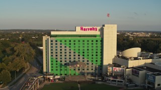 DX0002_172_003 - 5.7K aerial stock footage of a reverse view of the hotel and casino at sunset in Council Bluffs, Iowa